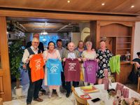 Together Against Cancer hands over running shirts to Harald Lappe's TravelEye aid team